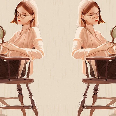 hai cô gái tóc ngắn đang ngồi trên ghế cầm quả địa cầu