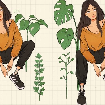hai cô gái mặc áo vàng ngồi giữa những chiếc lá