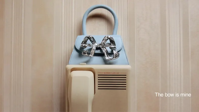 Túi Self Portrait xanh nơ bạc