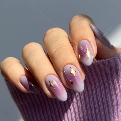 Kiểu nail aura màu tím đính họa tiết đẹp