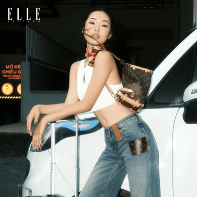 cô gái ELLE mang vali có tài chính ổn định